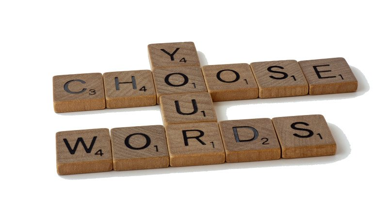 Wooden letter tiles spelling words, representing language and meaning.