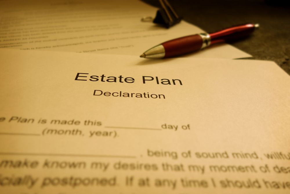 A pen rests on top of an estate plan declaration