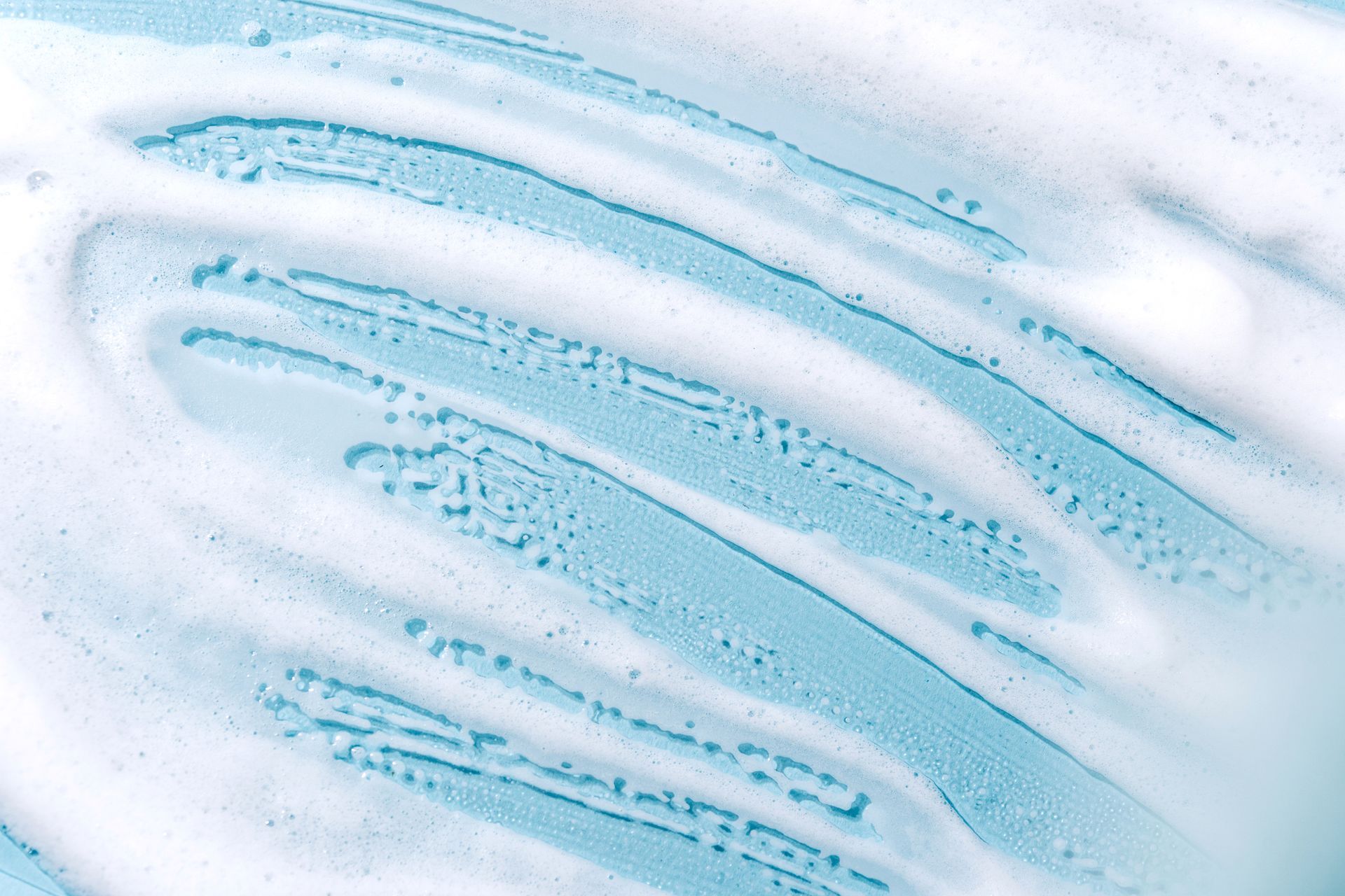 A Close Up Of A Swirl Of Soap Foam On A Blue Surface – Oviedo, FL – New Vision Renovation