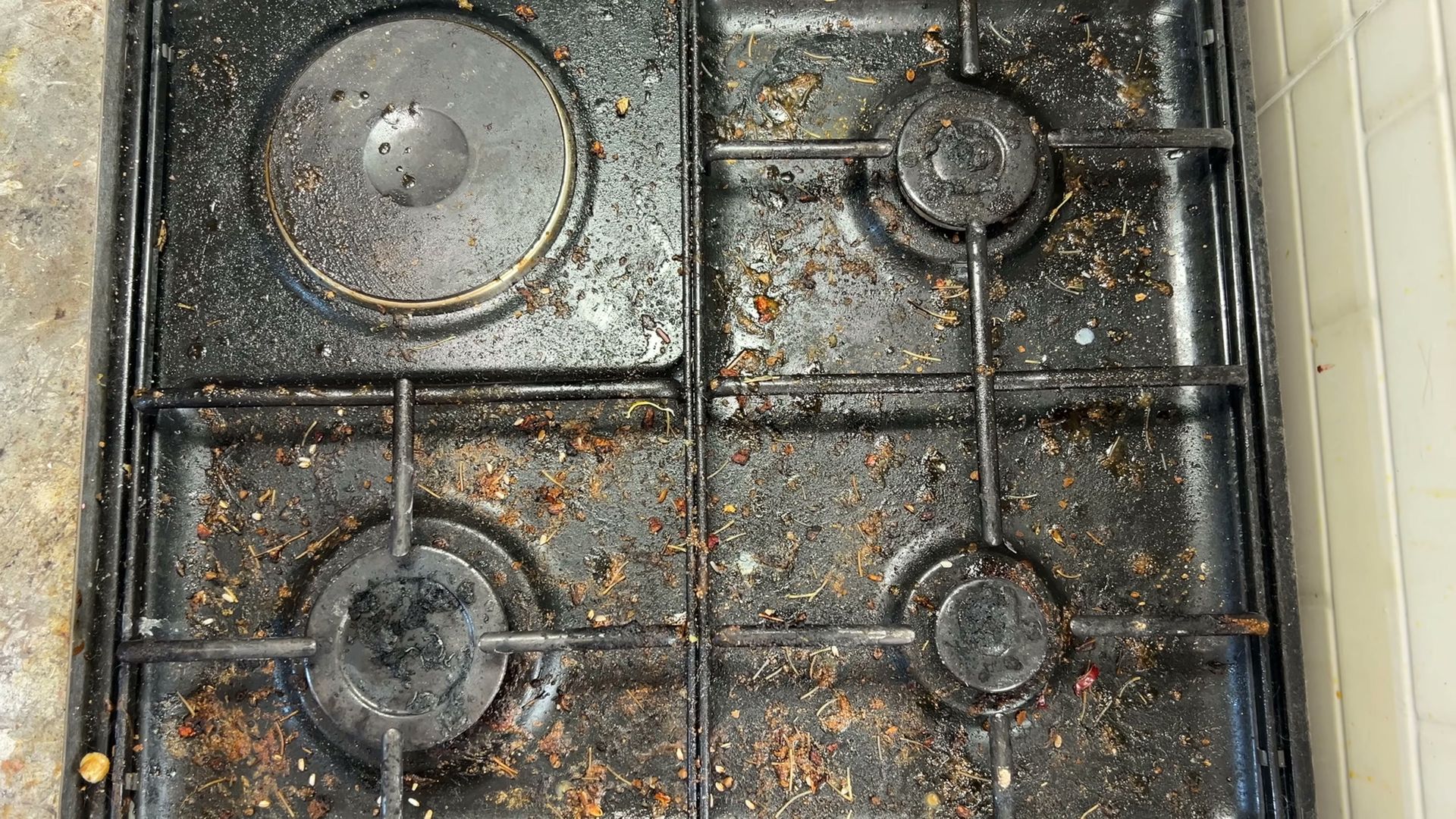 Dirty oven before professional deep cleaning service in a Manhattan New York apartment