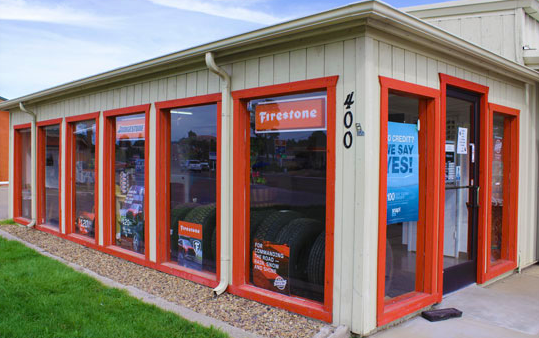 A building with a lot of windows and a sign that says precision on it.