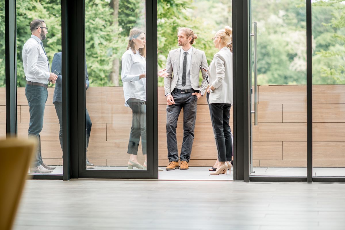 People Outside a Business. Learn the Commercial Leasing Process in Mid-MO With Lindner Properties.
