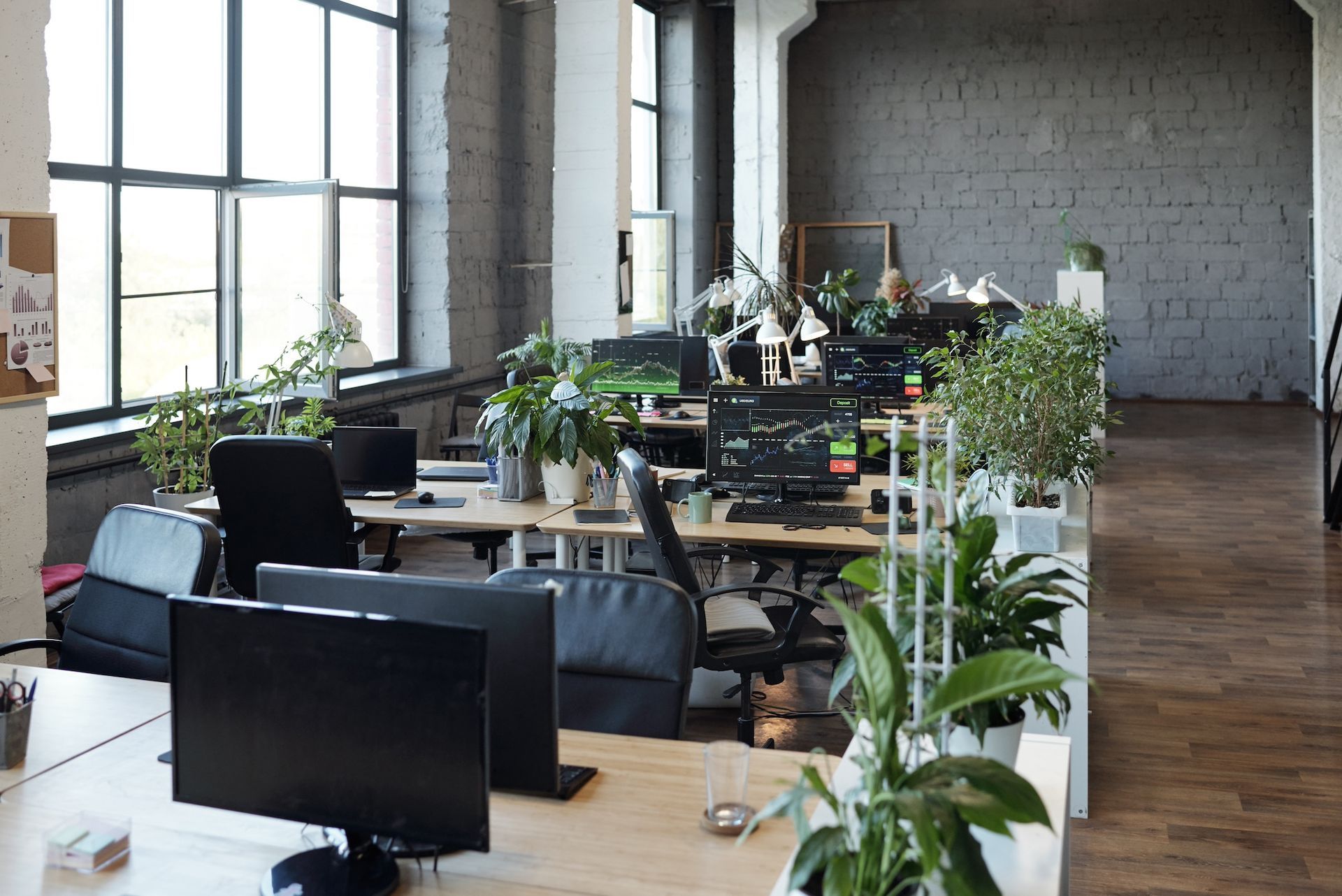 Office With an Open Floor Plan & Multiple Computer Desks & Chairs. Find Office Space in Columbia, MO