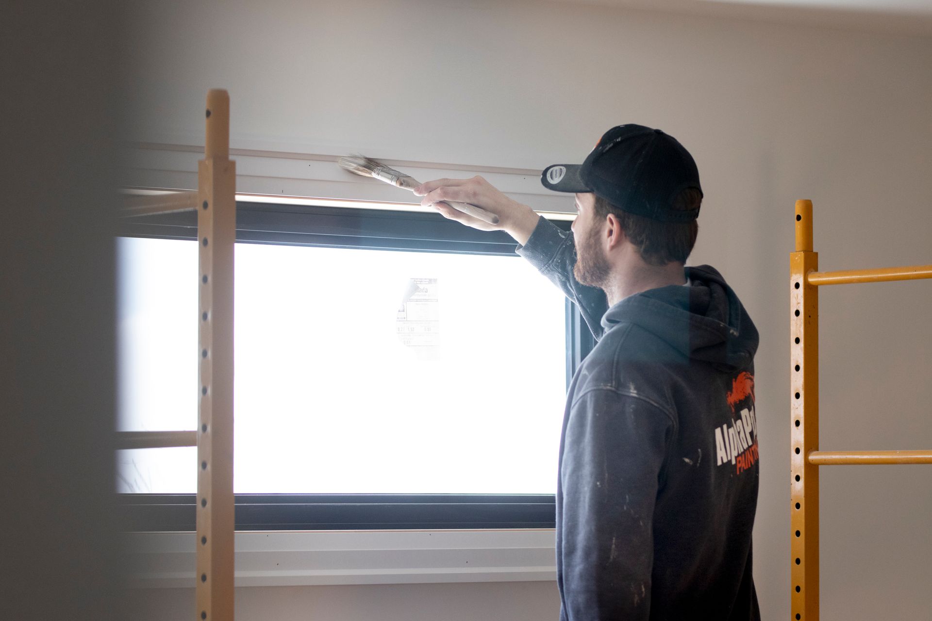 Surface preparation underway before trim painting