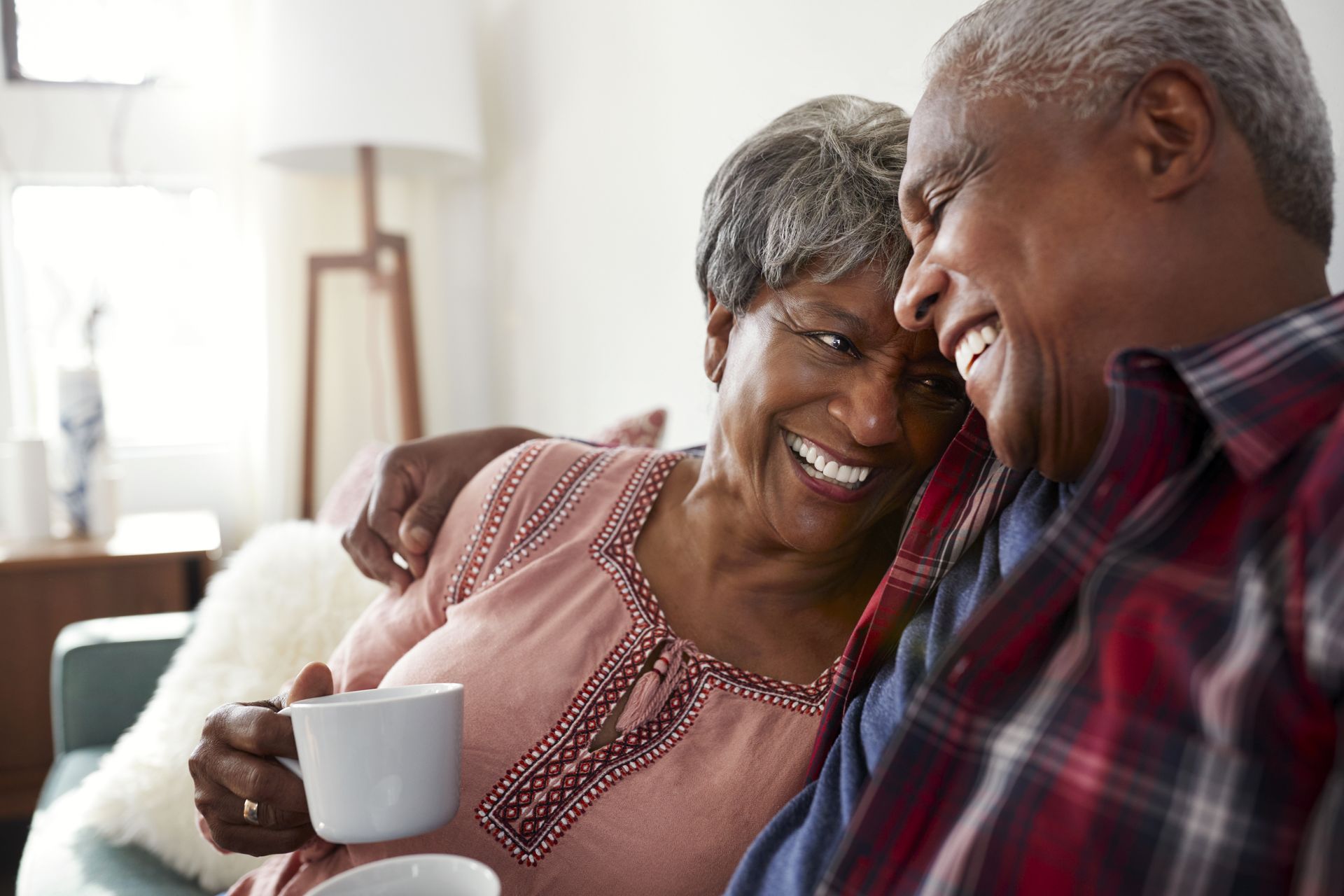 Couple admiring the results of a professional  exterior painting project