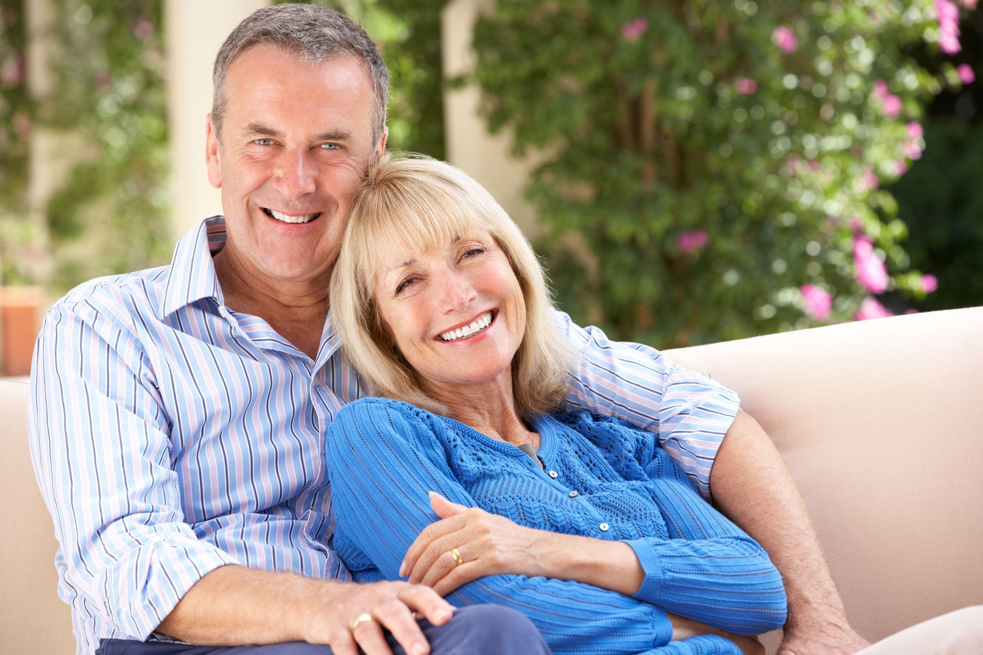 Homeowners celebrating completed painting project