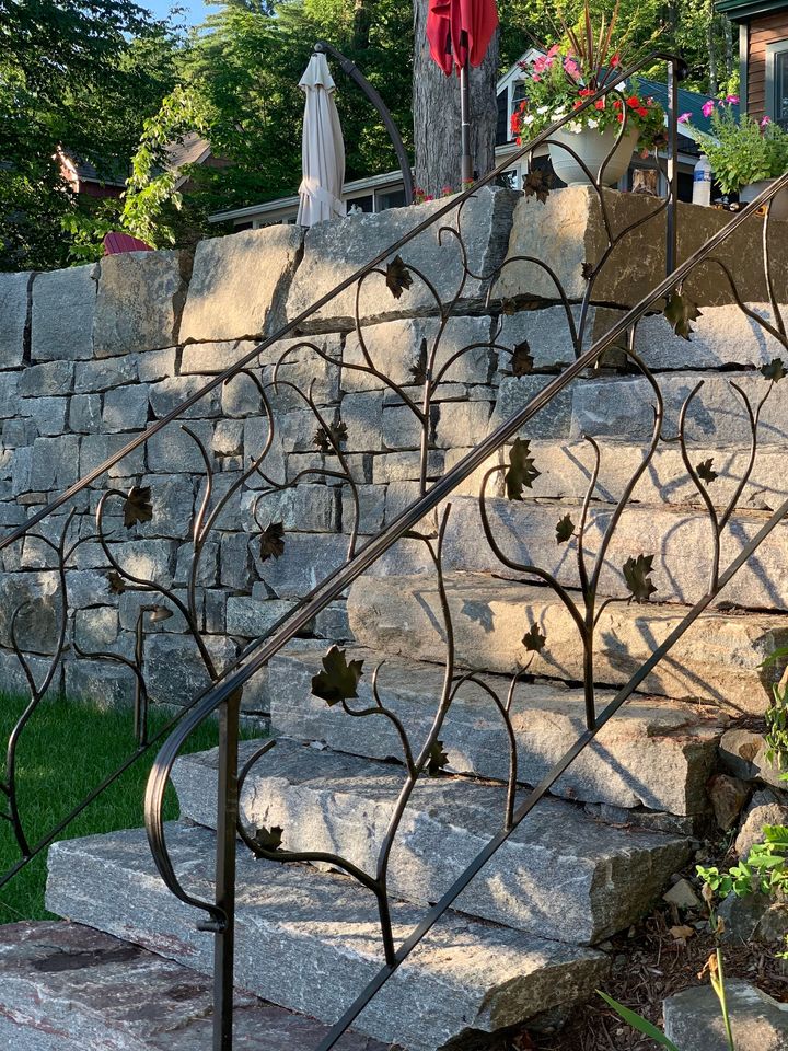metal raing with branching leaves design