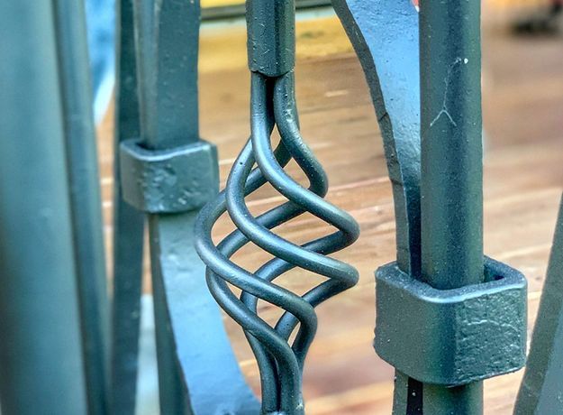 close up of metal railing with ornamental design
