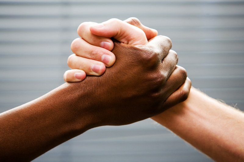 Image of shaking hands.