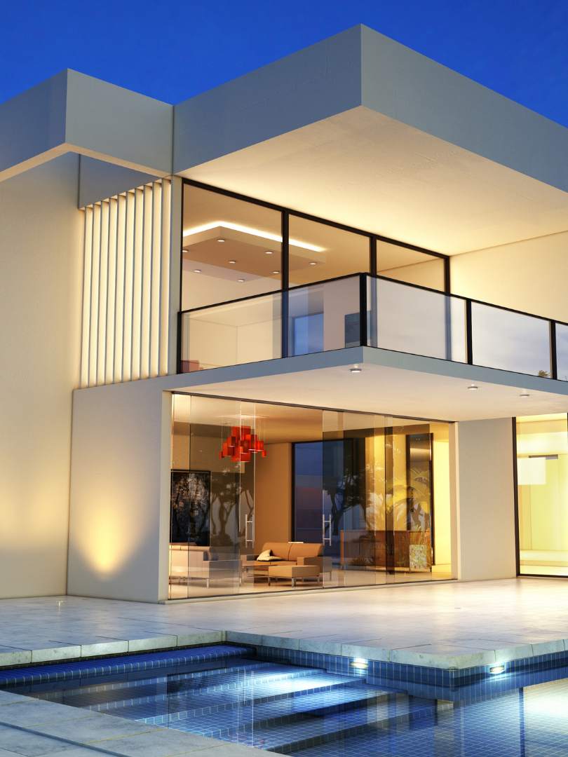 A modern house with a swimming pool in front of it