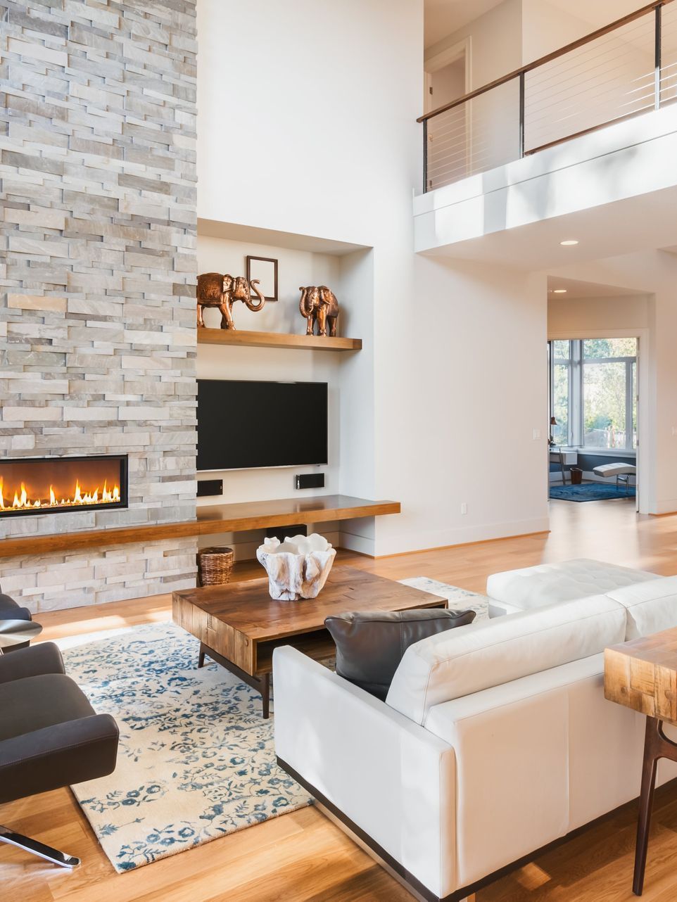 A living room with a fireplace and a couch