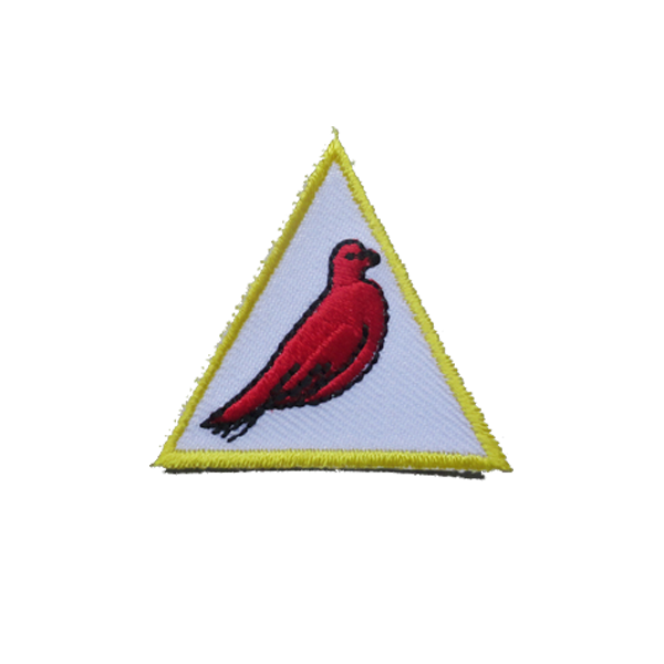 A white triangle with a red bird on it badge.