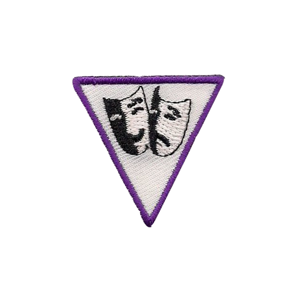 A purple and white triangle with two masks on it badge.