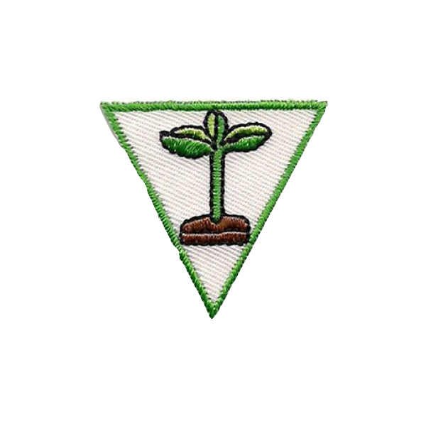 A green and white triangle with a plant growing out of it badge.