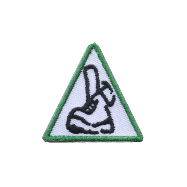 A triangle with a picture of a shoe on it badge.