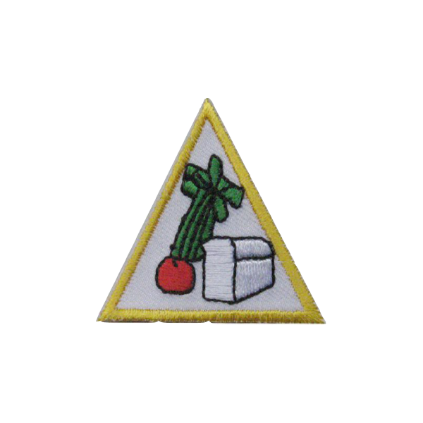 A triangle with a vegetable and a box in it badge.