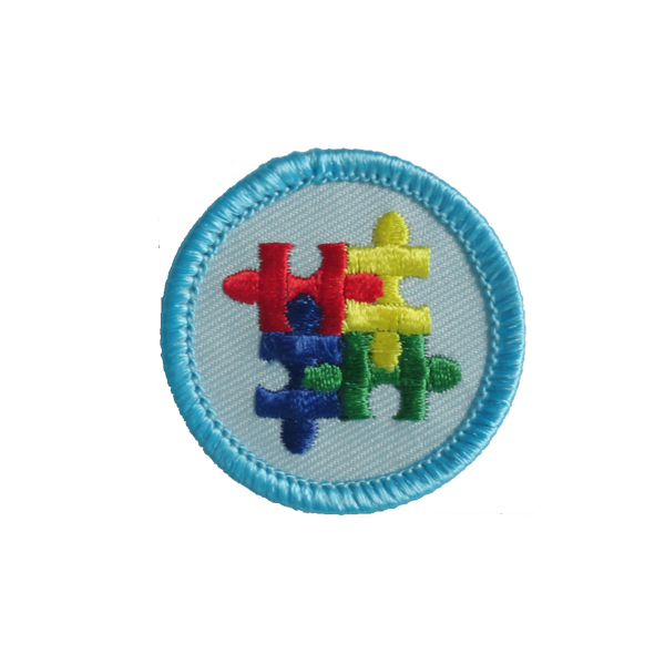 A blue and white patch with puzzle pieces on it award.