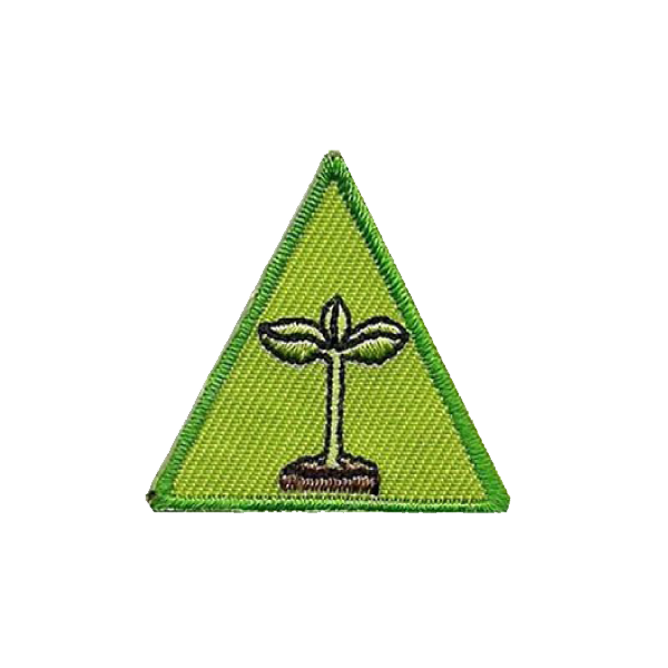 A green triangle with a plant growing out of it badge.
