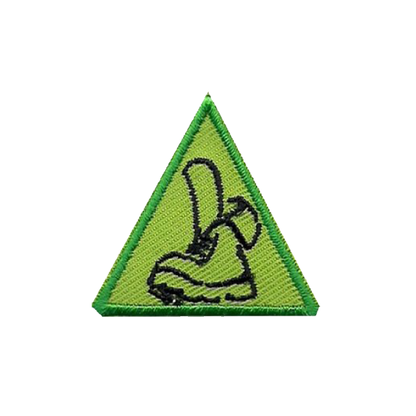 A green triangle with a picture of a boot on it badge.