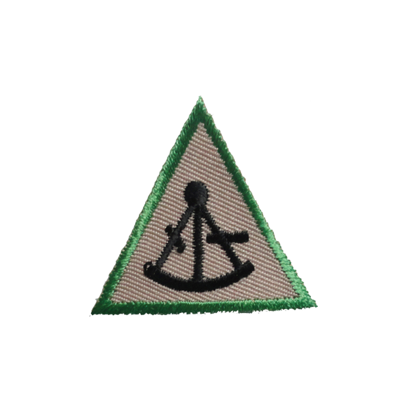A green and tan triangle with an anchor on it badge.