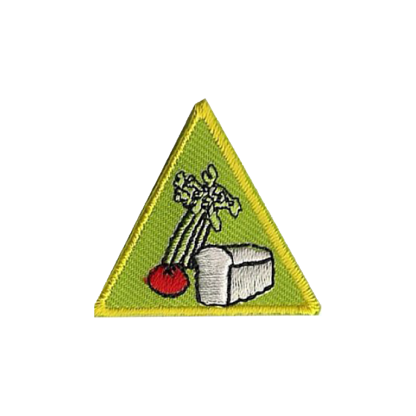 A green triangle with a picture of vegetables on it badge.