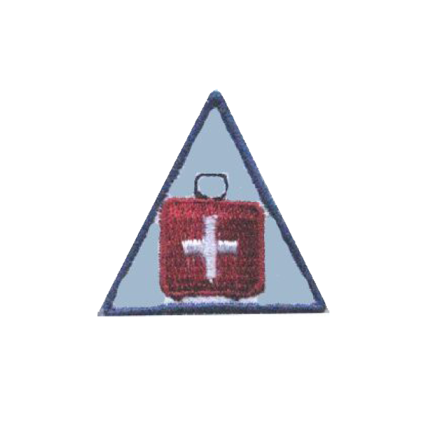 A triangle with a red box with a white cross on it badge.
