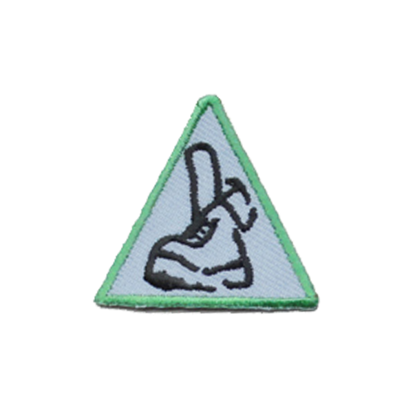 A triangle with a picture of a shoe on it badge.