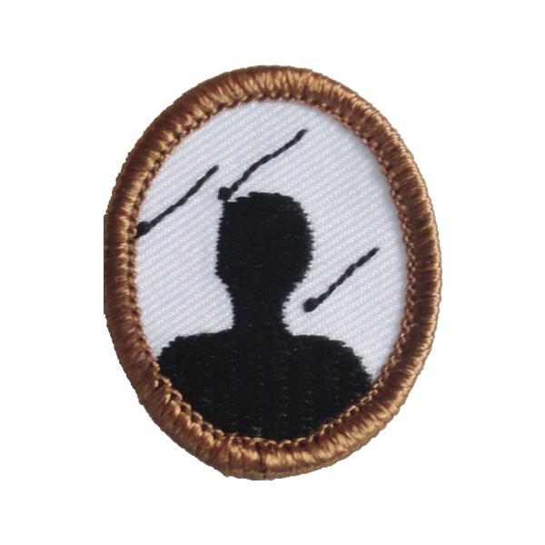A brown and white badge with a silhouette of a man award.