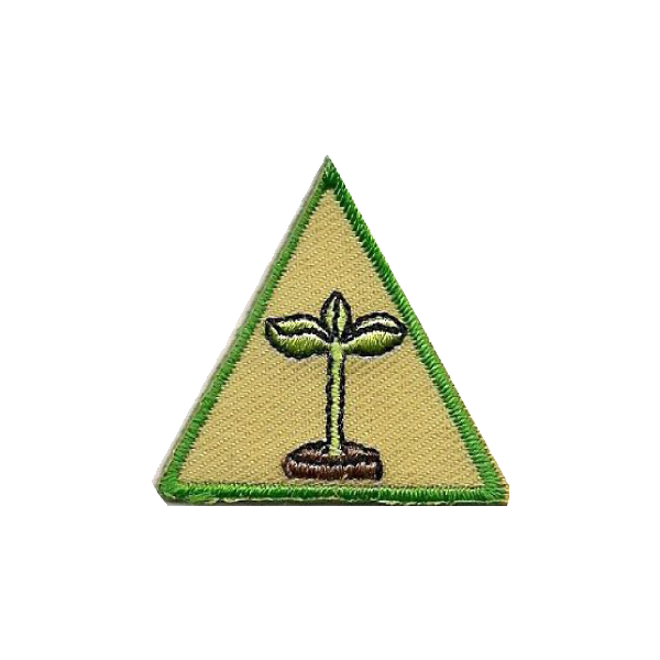 A triangle with a small plant inside of it badge.