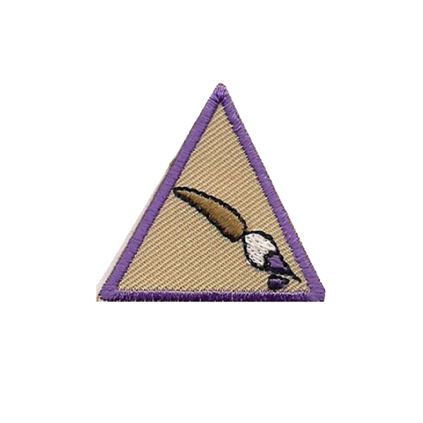 A patch with a triangle and a brush on it badge.