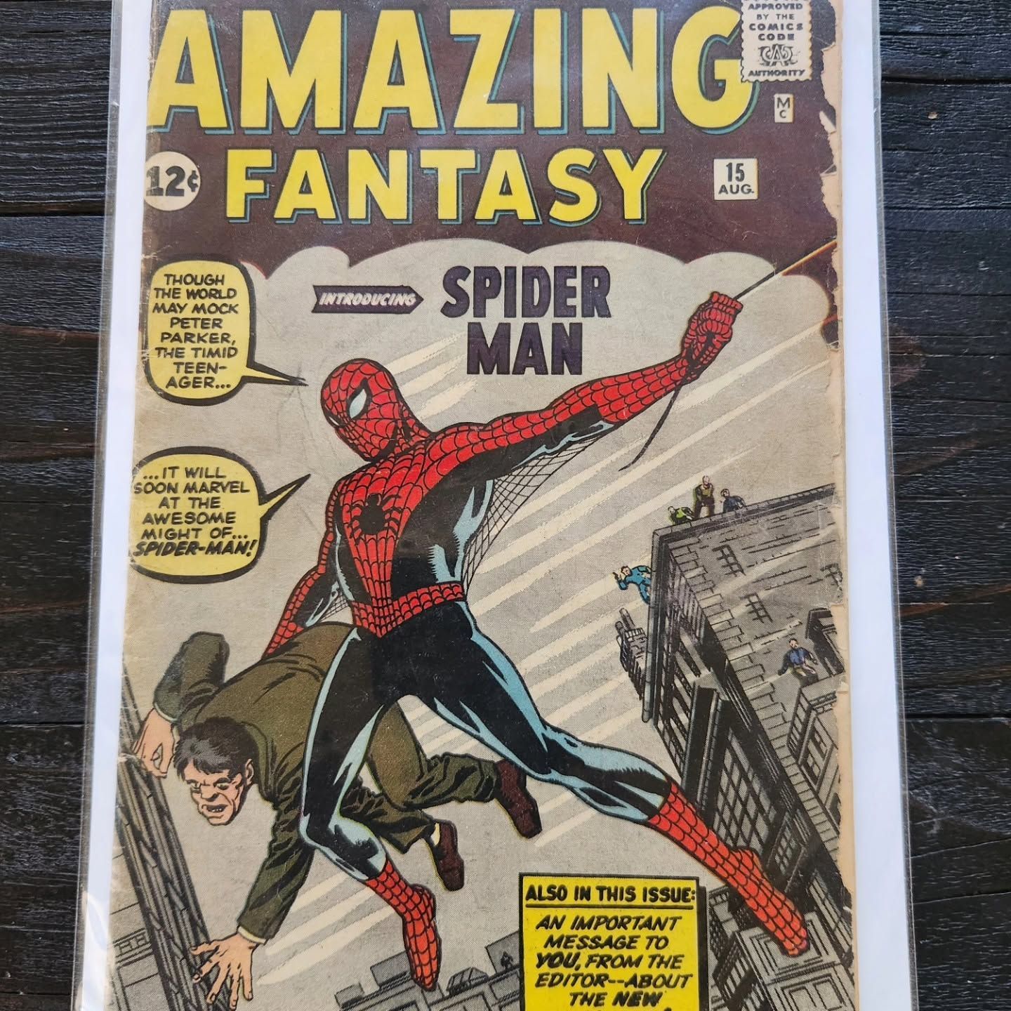 Amazing Fantasy Spider-Man comic cover with Spider-Man swinging over a city scene