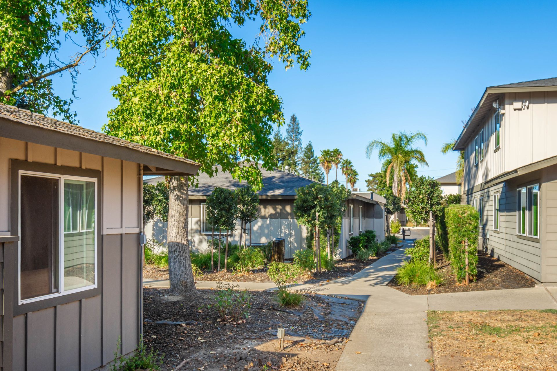 A row of houses with a walkway between them