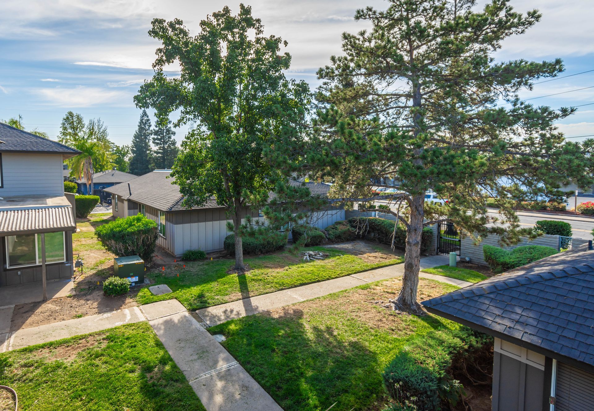 An aerial view of a residential neighborhood with houses and trees.