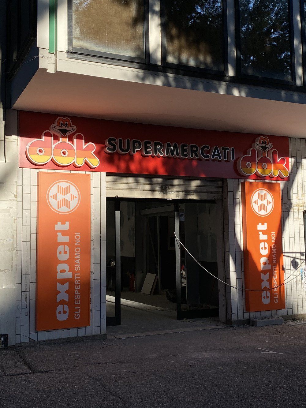 insegna dok supermercati