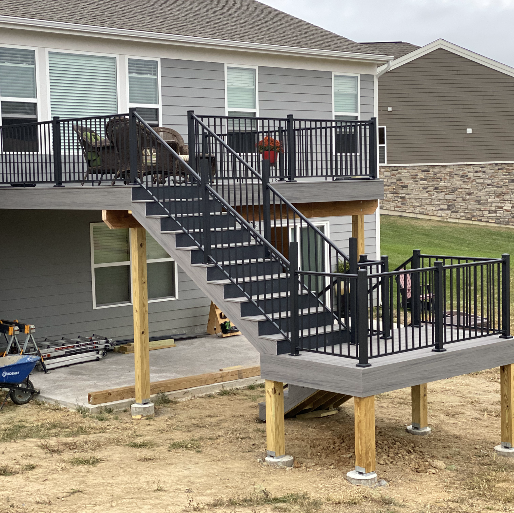 A house with a deck and stairs leading up to it