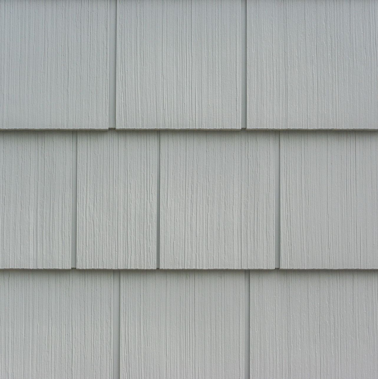 A close up of a gray vinyl siding on a house.
