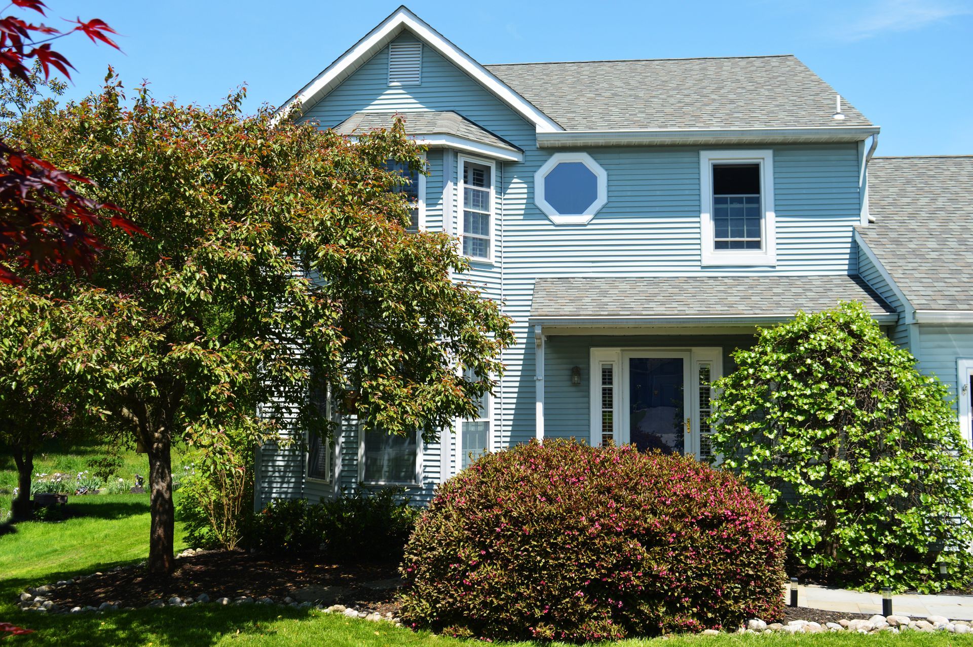 Home exterior and front yard with trending landscaping.