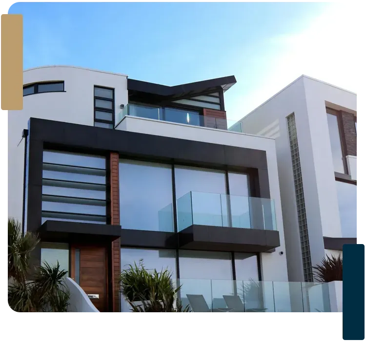 A large modern house with lots of windows and balconies