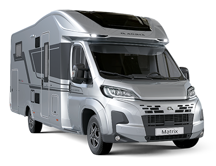 Silver Adria Matrix motorhome parked on a white background.