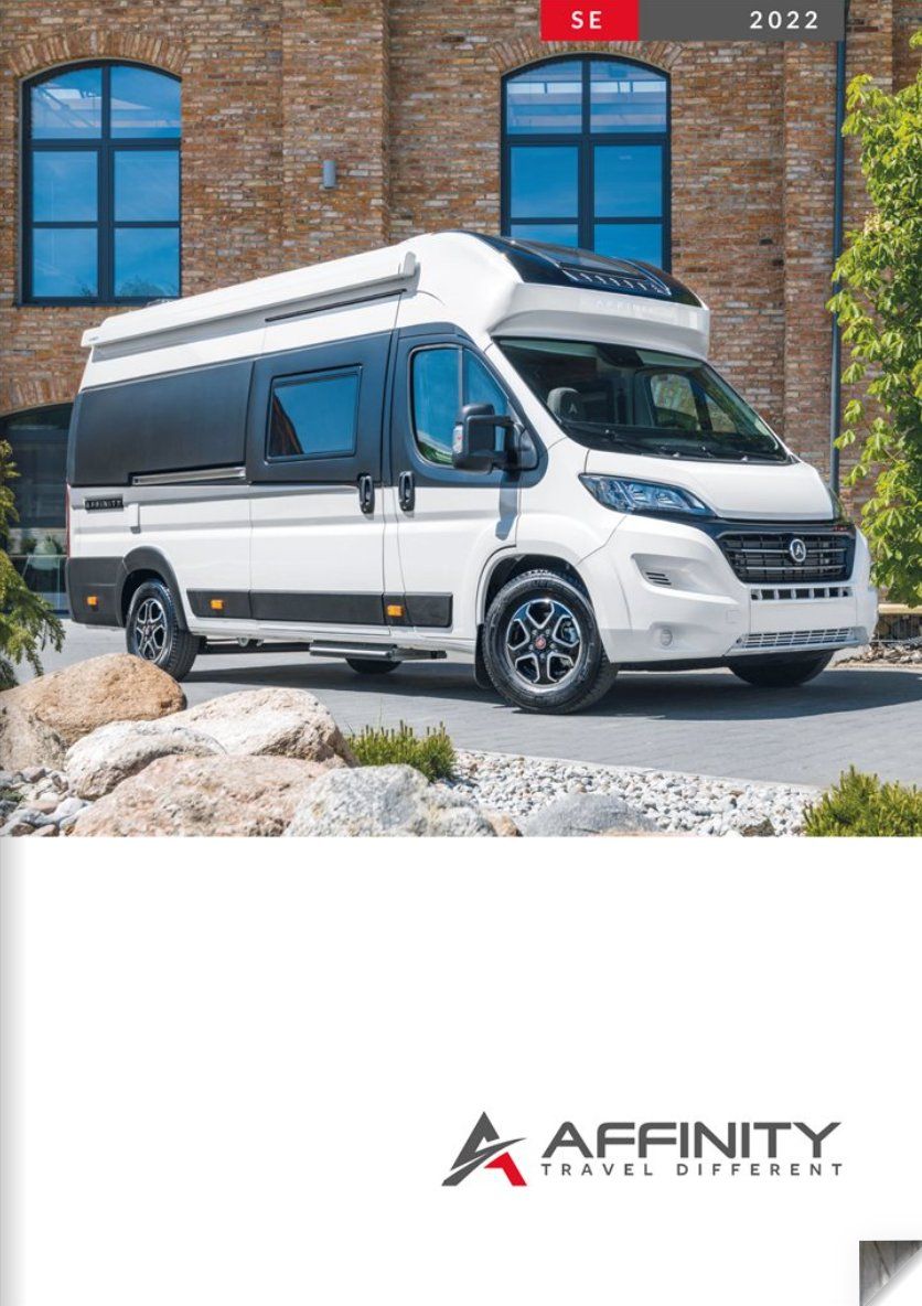 White campervan parked in front of a brick building. Affinity logo at the bottom.