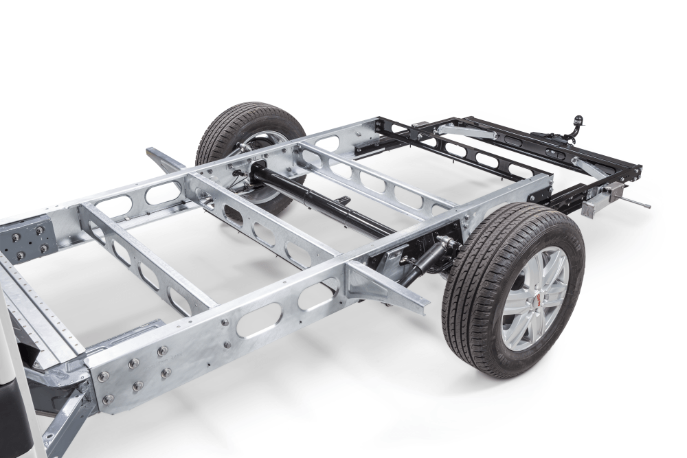 Metal vehicle chassis with two wheels attached, against a white background.