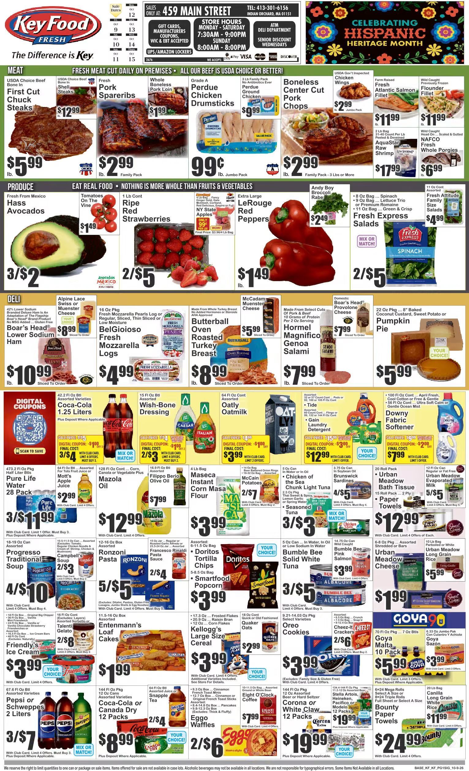 Produce section of assorted fresh fruits and vegetables in a grocery store aisle