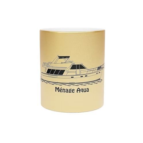 Beige ceramic mug with a black line drawing of a boat and the text “Ménage Auda”