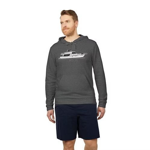 Woman wearing a dark gray hoodie with a white yacht graphic, standing against a plain white background