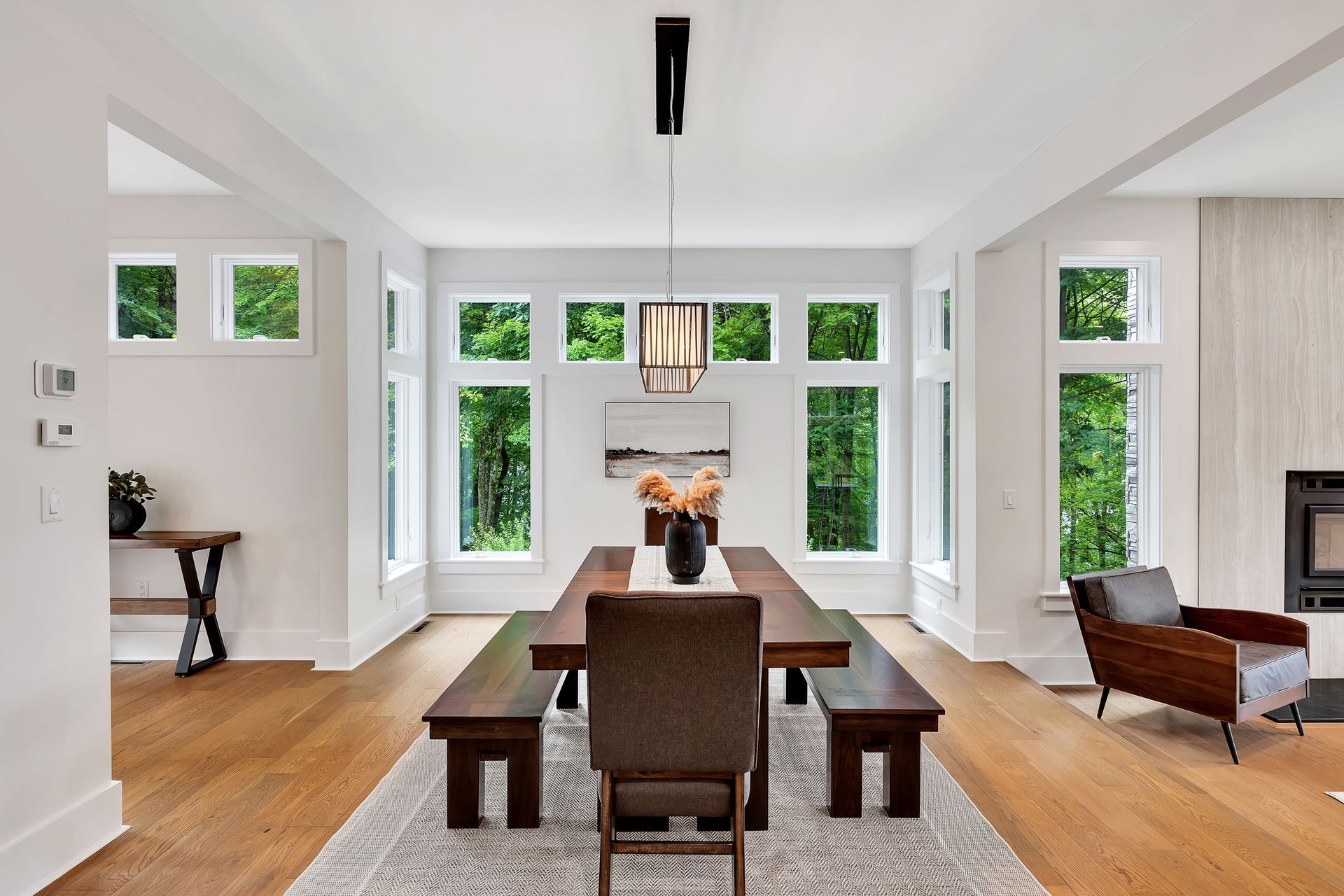 A dining room with a wooden table and benches