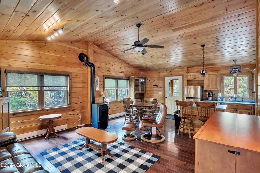 A dining room with a wooden table and benches