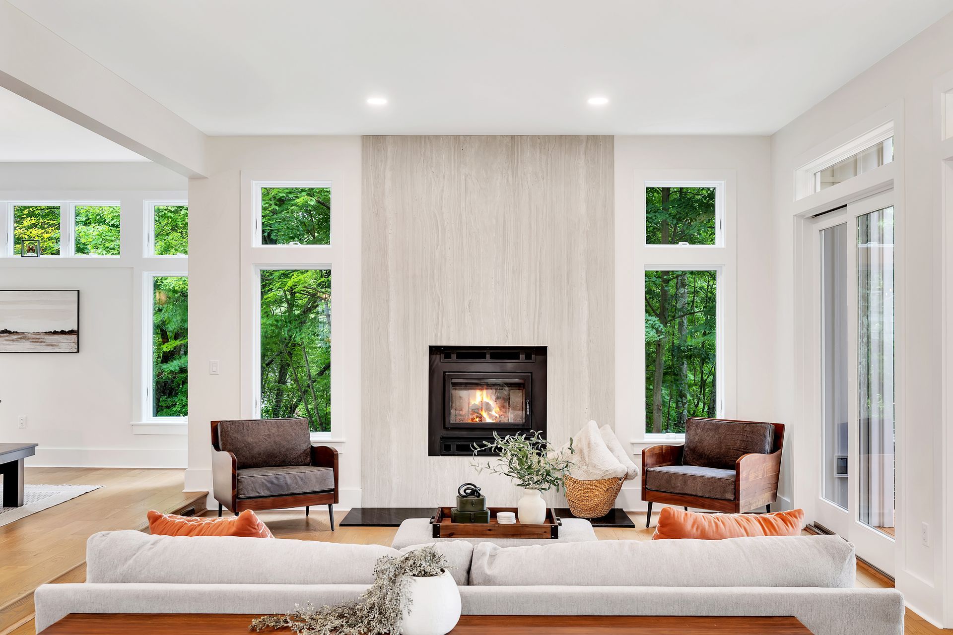 There is a fireplace in the middle of the living room.