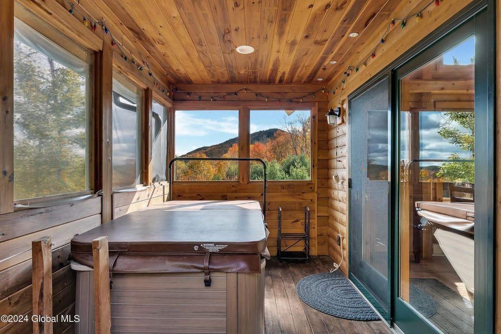 There is a hot tub in the middle of the room.