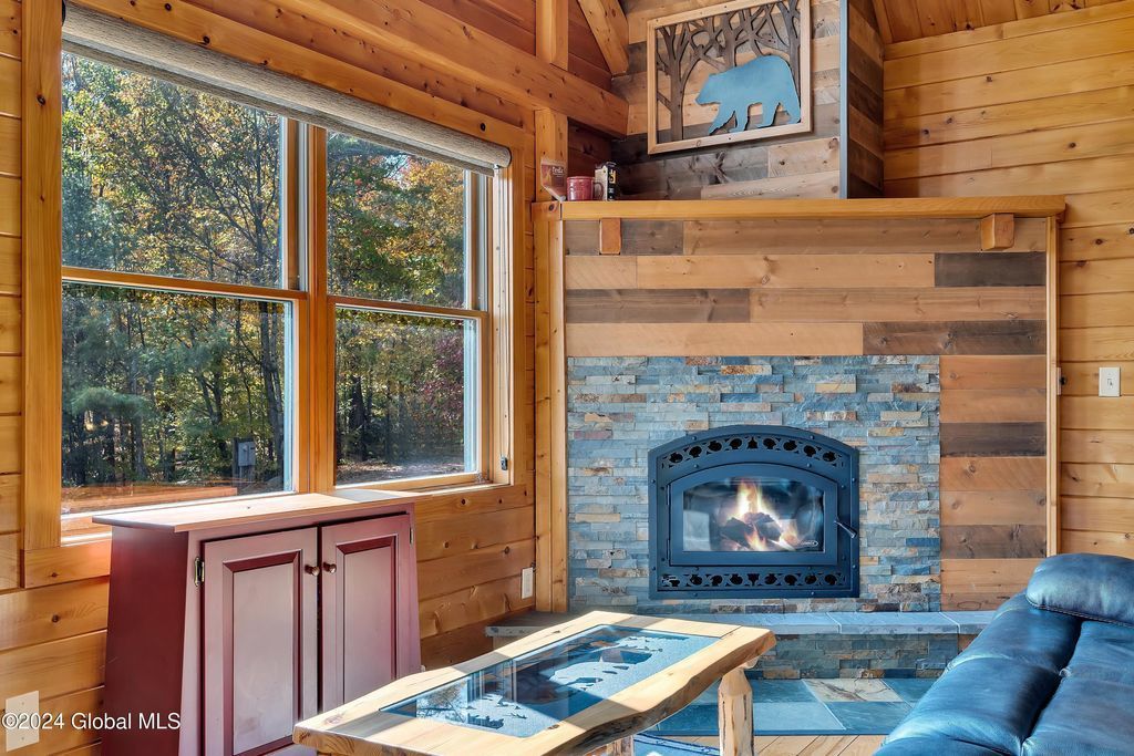 A living room with a fireplace and a couch.