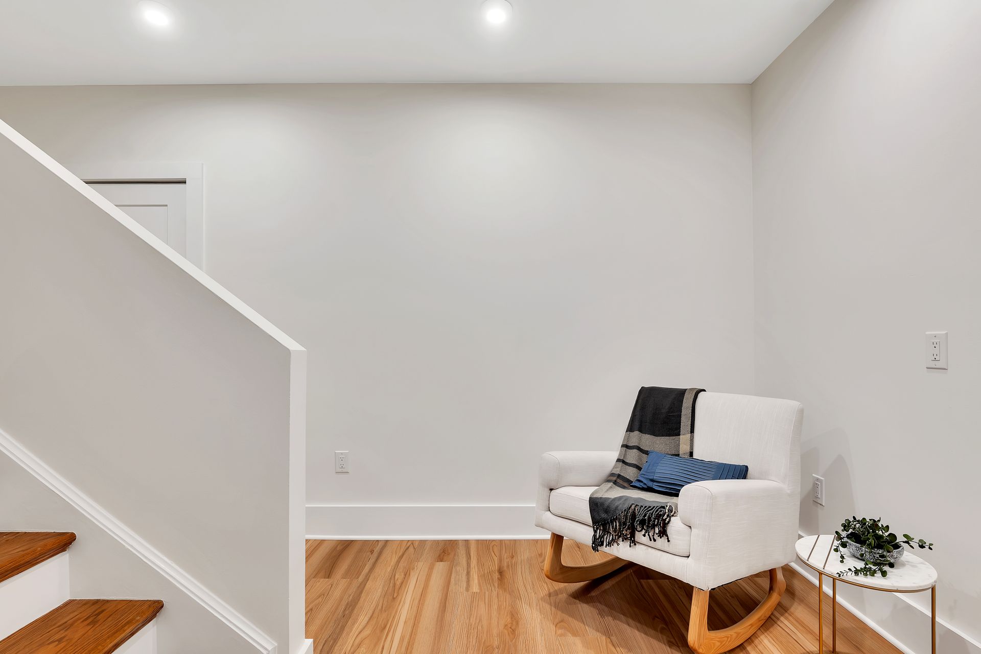 There is a rocking chair in the middle of the room.